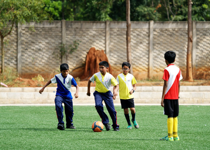 Outdoor sports activity on the school grounds at NewAge World School
