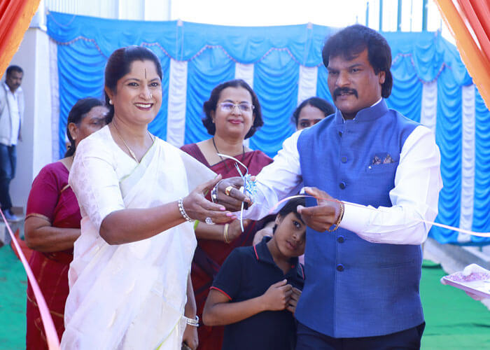 Ribbon-cutting ceremony during an event at NewAge World School.