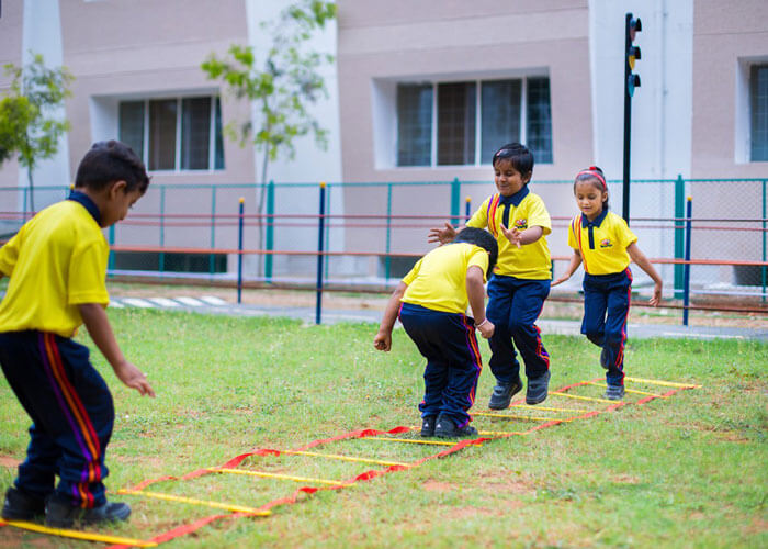 Students participating in an outdoor fitness drill at NewAge World School.