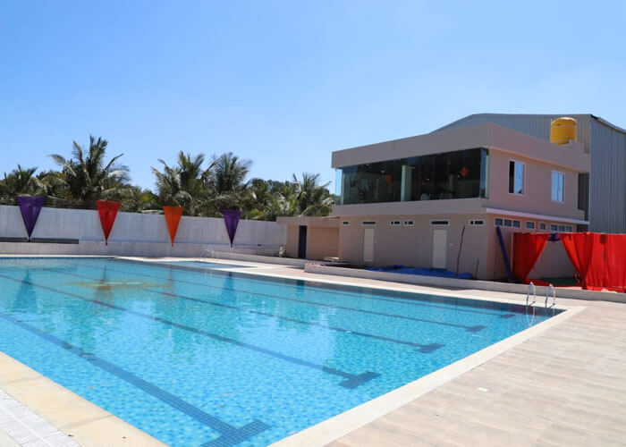 Olympic-sized swimming pool facility at NewAge World School for student activities.