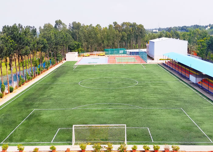Spacious football field and multi-sport facility at NewAge World School.